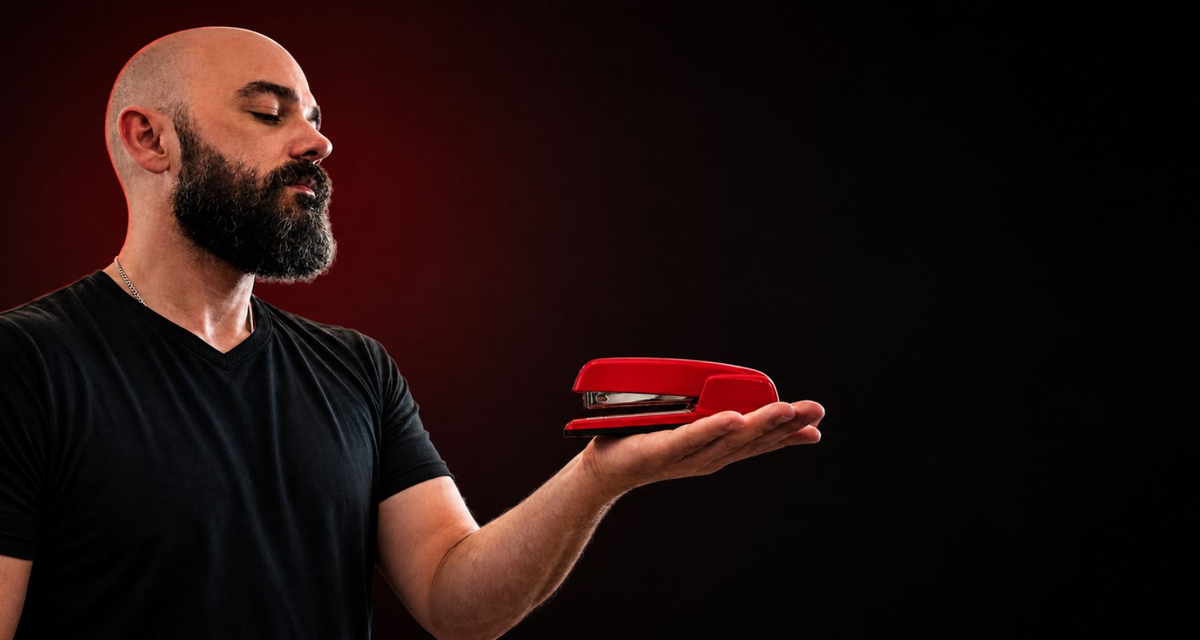 Scott holding the Red Stapler — the award itself
